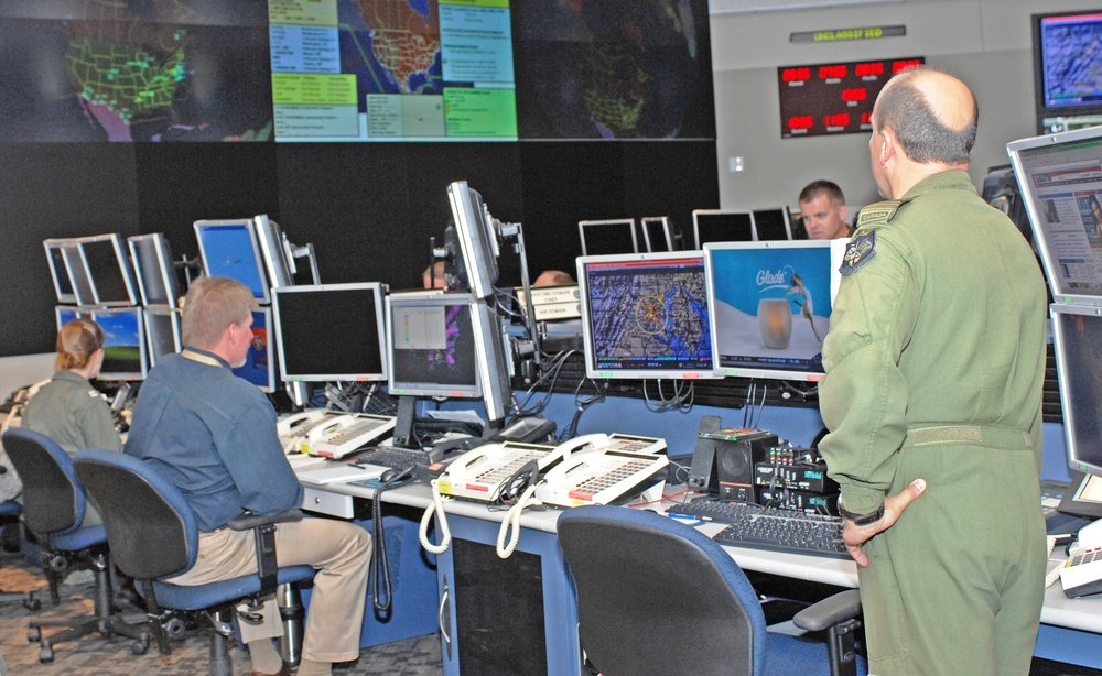 Integrated command center with mission displays and operations personnel